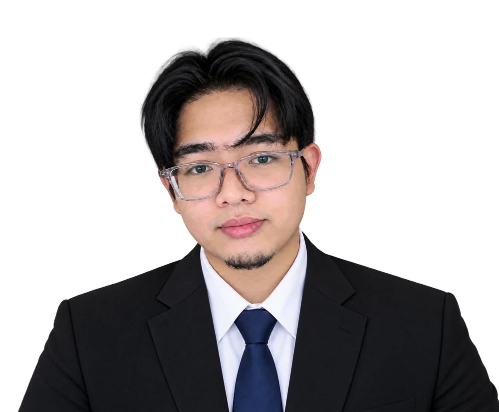 Afif Zuhdi, back-end and full-stack developer from Kedah, in a dark suit and tie